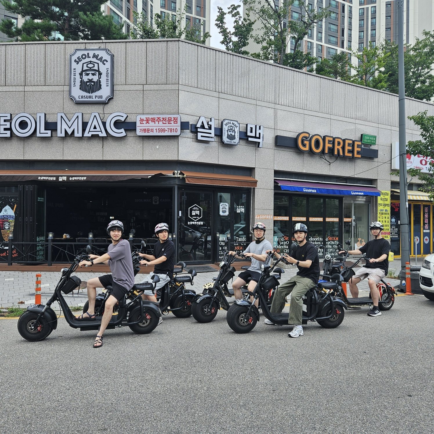 Labmates riding scooters