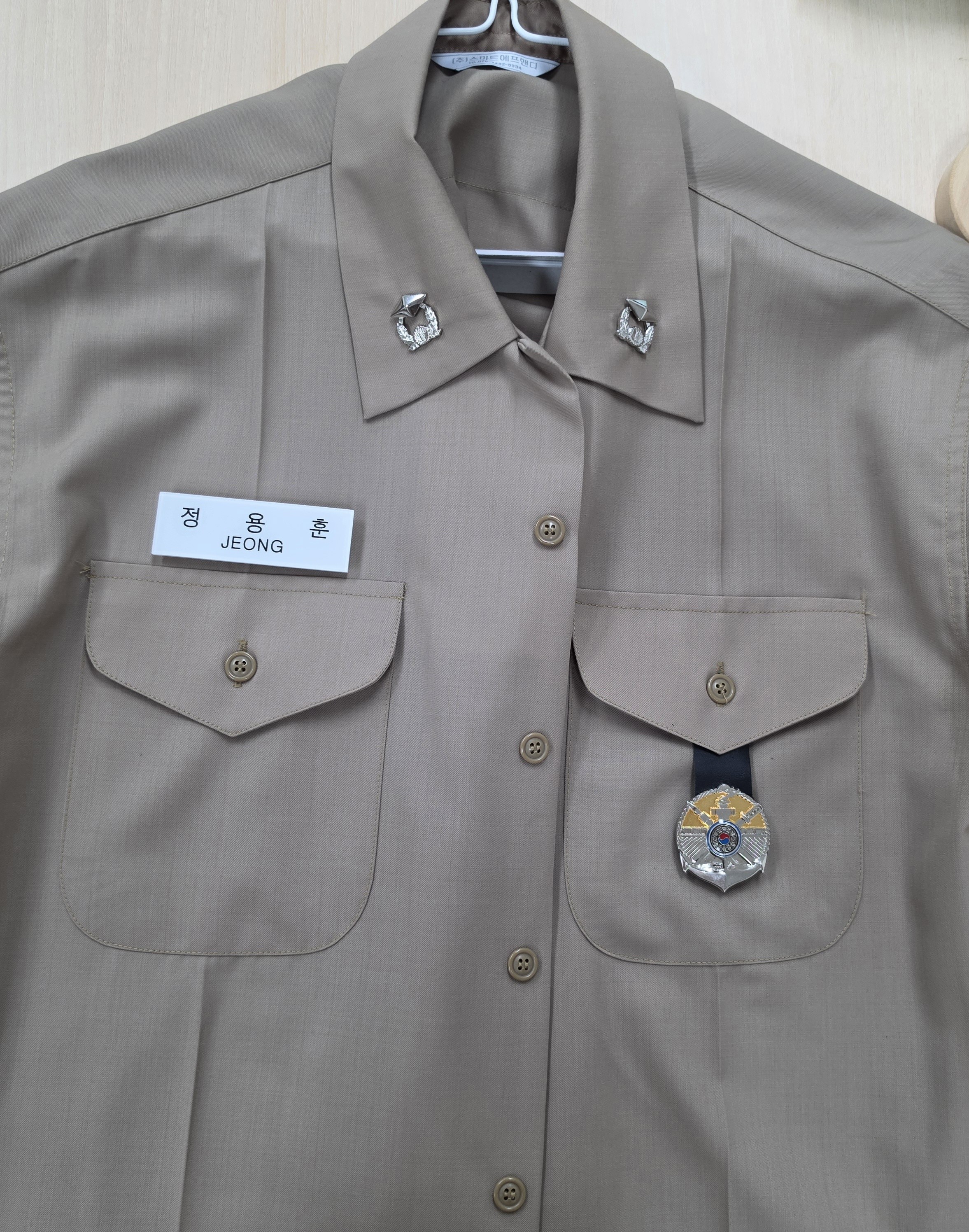 Uniform with the faculty insignia